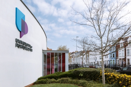 Exterior of a University of Portsmouth buidling with logo