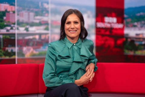 Anjana Gadgil sitting on a sofa in the BBC News studio