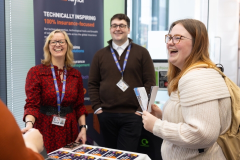 Student at a careers fair interacting with employers