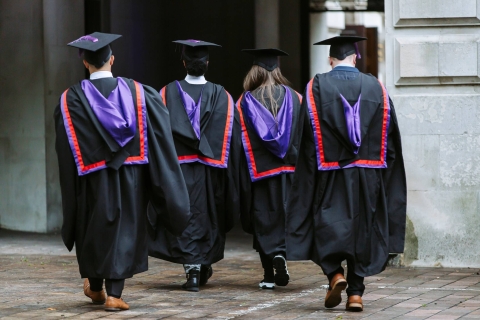 Graduates walking away from the camera