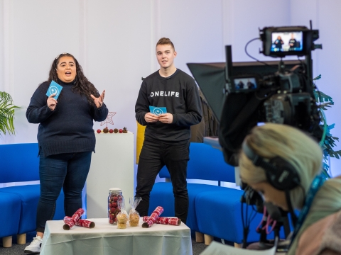 Students presenting on set in CCI TV Studios