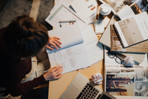 Student writing an exam paper