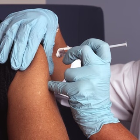 A close up of someone getting an injection