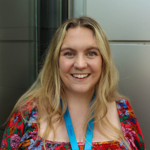 Picture of a young woman with blond hair smiling and standing outside the Careers and Employability Centre